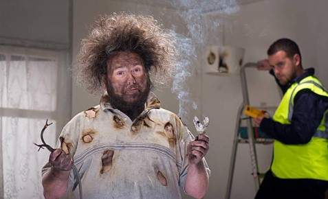 man with broken electrical equipment
